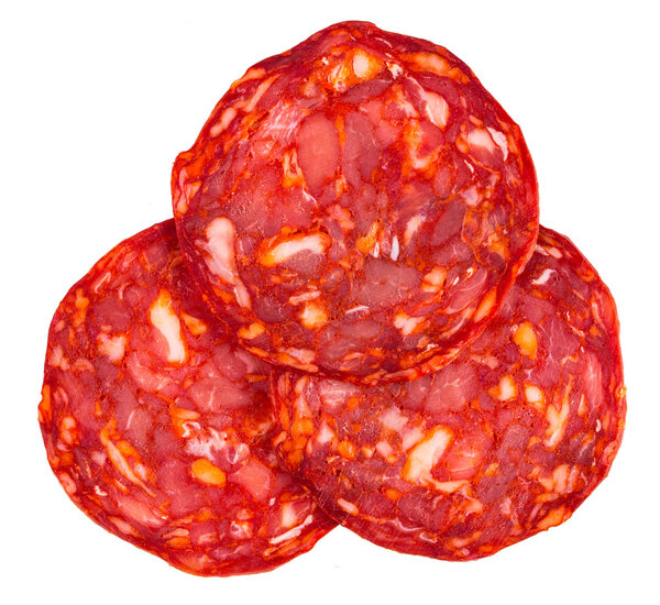 Cut Spanish sausage or salami chorizo. Isolated on white