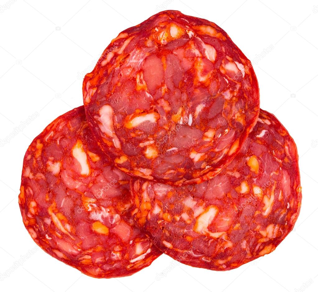 Cut Spanish sausage or salami chorizo. Isolated on white