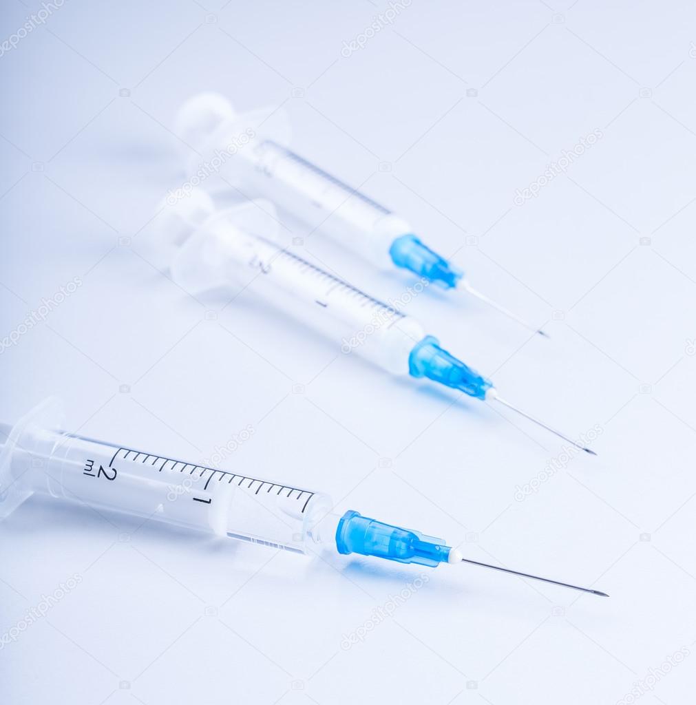 Close-up of plastic syringe on white background.