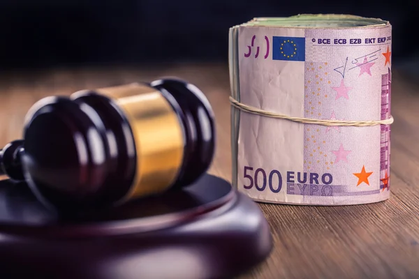 Euro currency. Court gavel and rolled Euro banknotes. Representation of corruption and bribery in the judiciary. — Stock Photo, Image