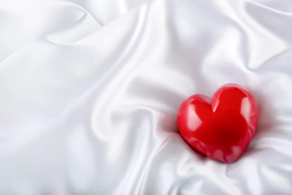 Valentines day. Hand made valentine heart. Wedding day. Red valentines hearts on white satin. Text: I love you — Zdjęcie stockowe