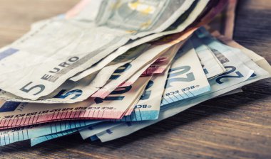 Several hundred euro banknotes stacked by value. Euro money concept. Euro banknotes. Euro money. Euro currency. Banknotes stacked on each other in different positions. Toned photo
