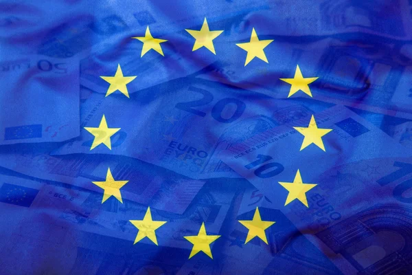 Euro flag. Euro money. Euro currency. Colorful waving european union flag on a euro money background — Zdjęcie stockowe