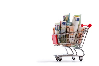 Shopping trolley full of euro money - banknotes - currency. Symbolic example of spending money in shops, or advantageous purchase in the shopping center