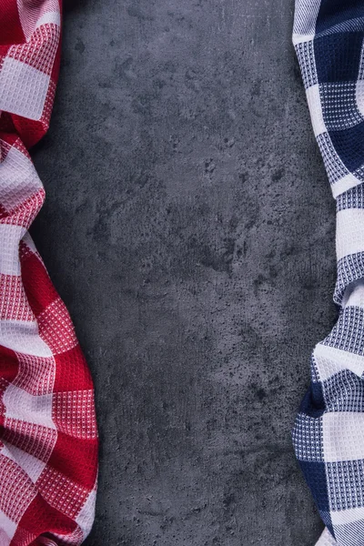 Top view of checkered kitchen tablecloth on granite -  concrete - stone background. Free space for your text or products — 图库照片