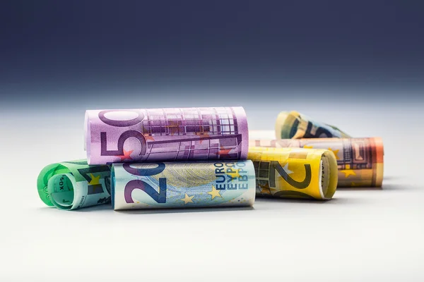 Several hundred euro banknotes stacked by value. Euro money concept. Rolls Euro  banknotes. Euro currency. Announced cancellation of five hundred euro banknotes. Banknotes stacked on each other in different positions. Toned photo — Φωτογραφία Αρχείου