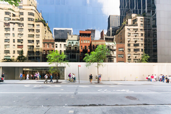 New York City, USA - August 2, 2013:People stop in front of the entrance to the Moma, the famous museum of modern art in New York during a sunny day.