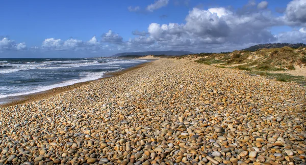 Beach rolling stones — Stock Photo, Image