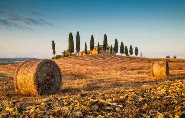 Scenic Tuscany landscape with farm house at sunset, Val d'Orcia, Italy clipart