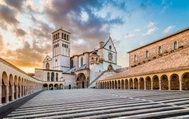 Famous Basilica of St. Francis of Assisi at sunset in Assisi, Umbria, Italy clipart