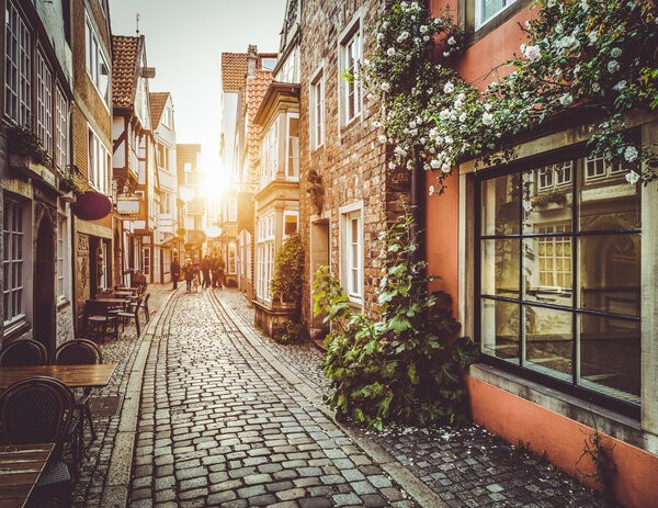 Old town in Europe at sunset with retro vintage filter effect