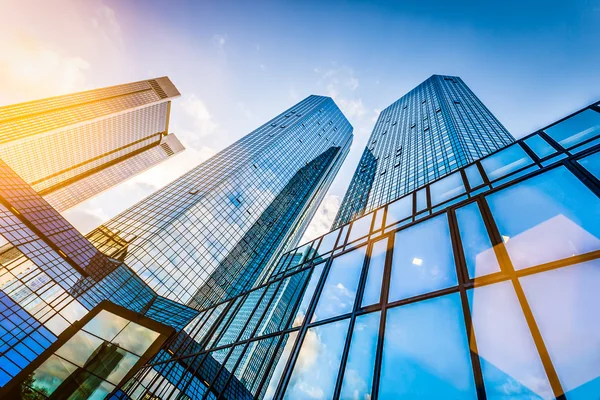 Modern skyscrapers in business district at sunset