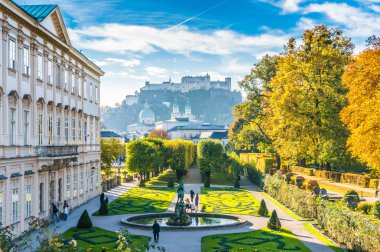 Famous Mirabell Gardens with historic Fortress in Salzburg, Austria clipart