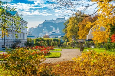 Famous Mirabell Gardens with historic Fortress in Salzburg, Austria clipart