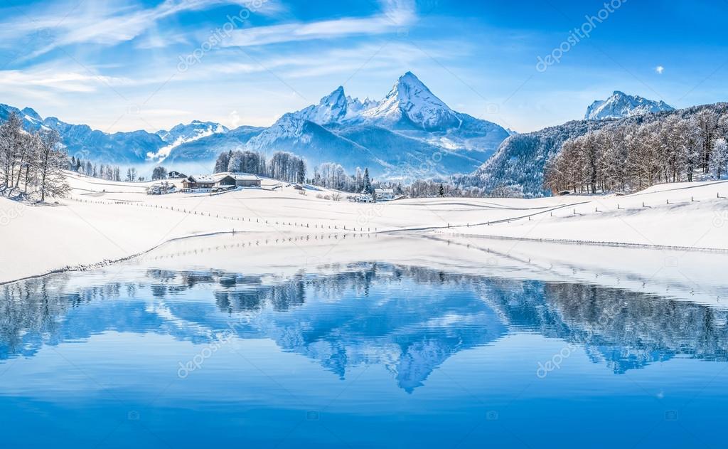 Winter wonderland with mountain lake in the Alps