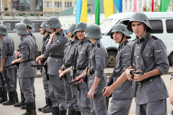 Uralsk, Kazakhstan (Qazaqstan), 7.05.2015: Young guys in the German uniform of the Great Patriotic War in the city. Theatrical performance on the city street in honor of Victory Day on May 9.