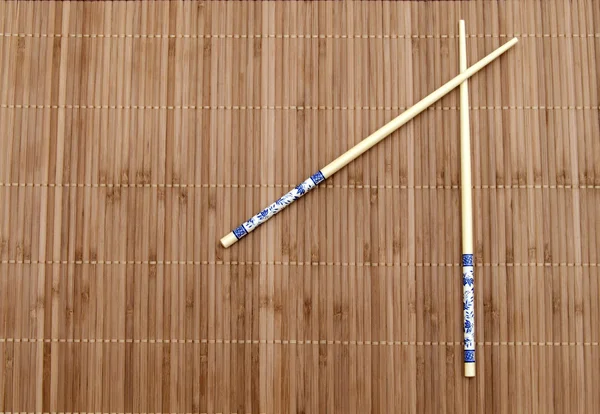 Chopsticks on the mat — Stock Photo, Image