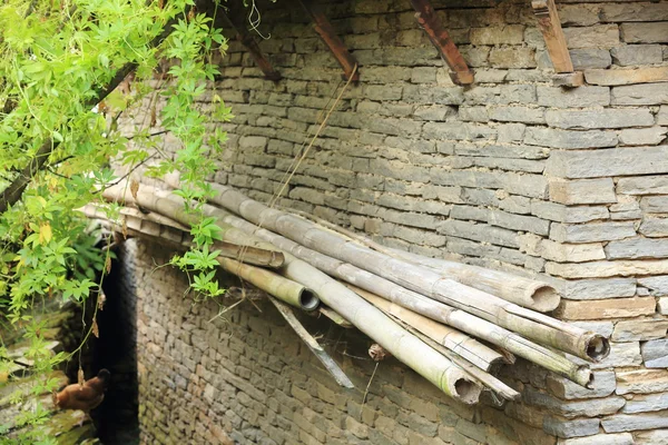 Bamboo canes on stone wall. Ghandruk-Nepal. 0615 — Stock Photo, Image