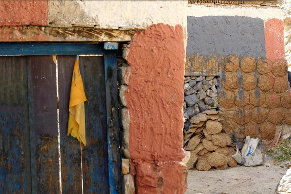 Blue wooden door on stone wall. Sakya-Tibet. 1828 — Stock Photo, Image