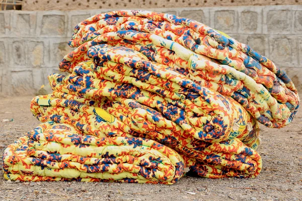 Colorful mattress on the ground-sunday market. Senbete-Ethiopia. 0055 — Stock Photo, Image