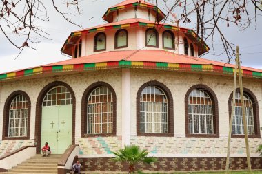 Men sitting at the church.s closed gate. Kombolcha-Ethiopia. 0081