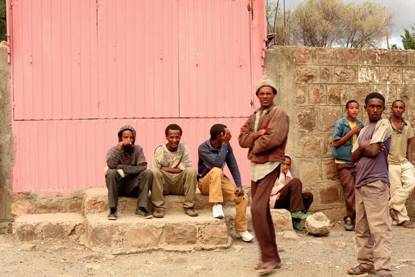 Some devotees wait outside Bete Gebriel church compound. Kombolcha-Ethiopia. 0091 — Stock Photo, Image