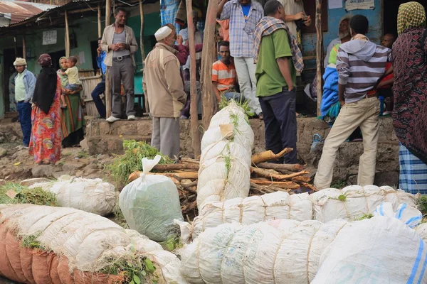 Locals and packs of khat leaves-khat market. Degan town-Ethiopia. 0105 — Stock Photo, Image