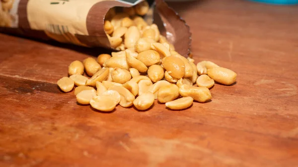 Salted Nuts Poured Out Package — Stock Photo, Image