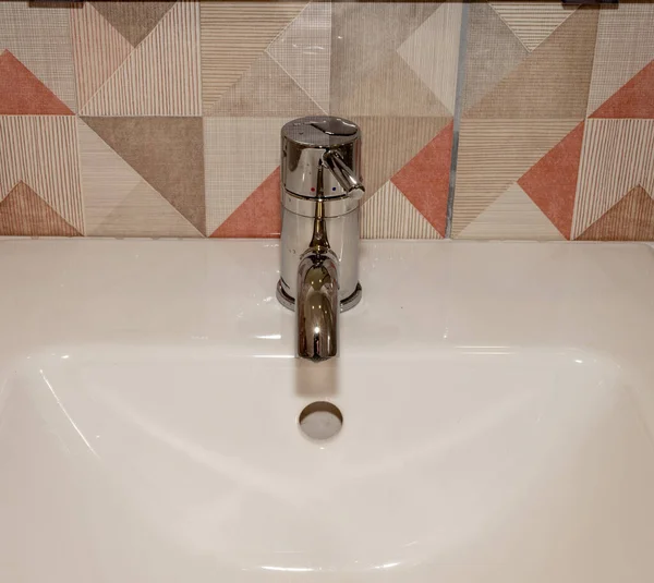 Very high end faucet, sink, and counter in a luxury bathroom - with water split on — Stock Photo, Image