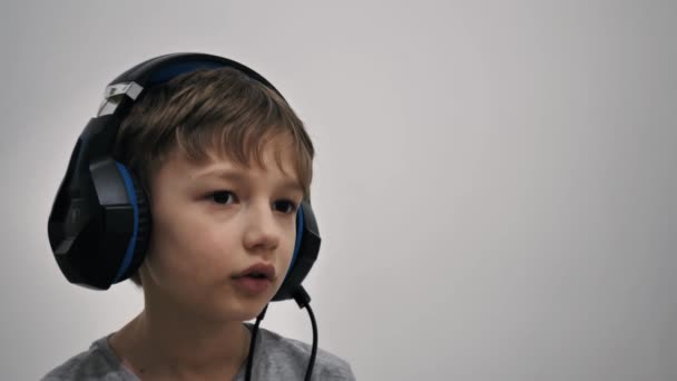 Young gamer in headphones playing — Stock Video
