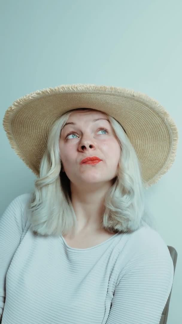 Vertical video. portrait of a blonde woman with red lips on a white background — Stock Video