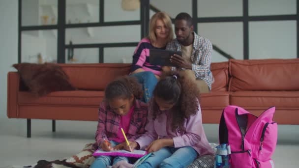 Lovely schoolgirls learning together at home — Stock Video