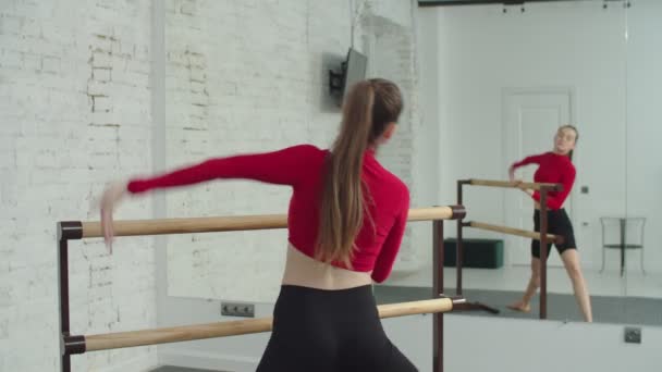 Active fit female doing barre workout in gym — Stock Video