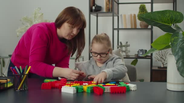 Caring mom developing disabled kid skills with learning games — Stock Video