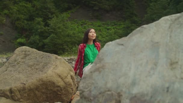 Lovely relaxed asian female traveler enjoying recreation and scenic nature by mountain river — Stock Video