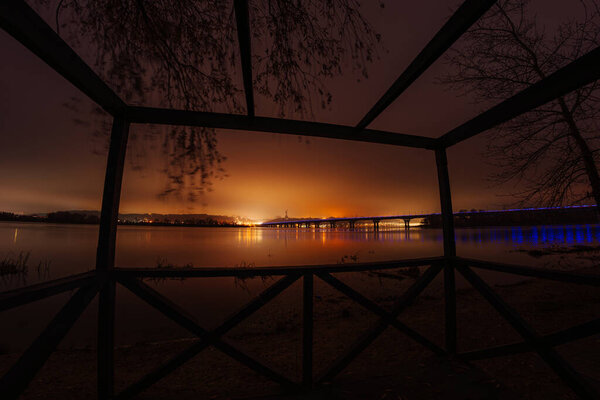 Paton Bridge at Night in Autumn, Kyiv, Ukraine. Night view of the historic Paton Bridge illuminated over the Dnipro River in Kyiv, Ukraine, during the autumn season.