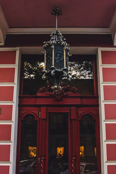 Old wooden weathered door in ancient town architecture.