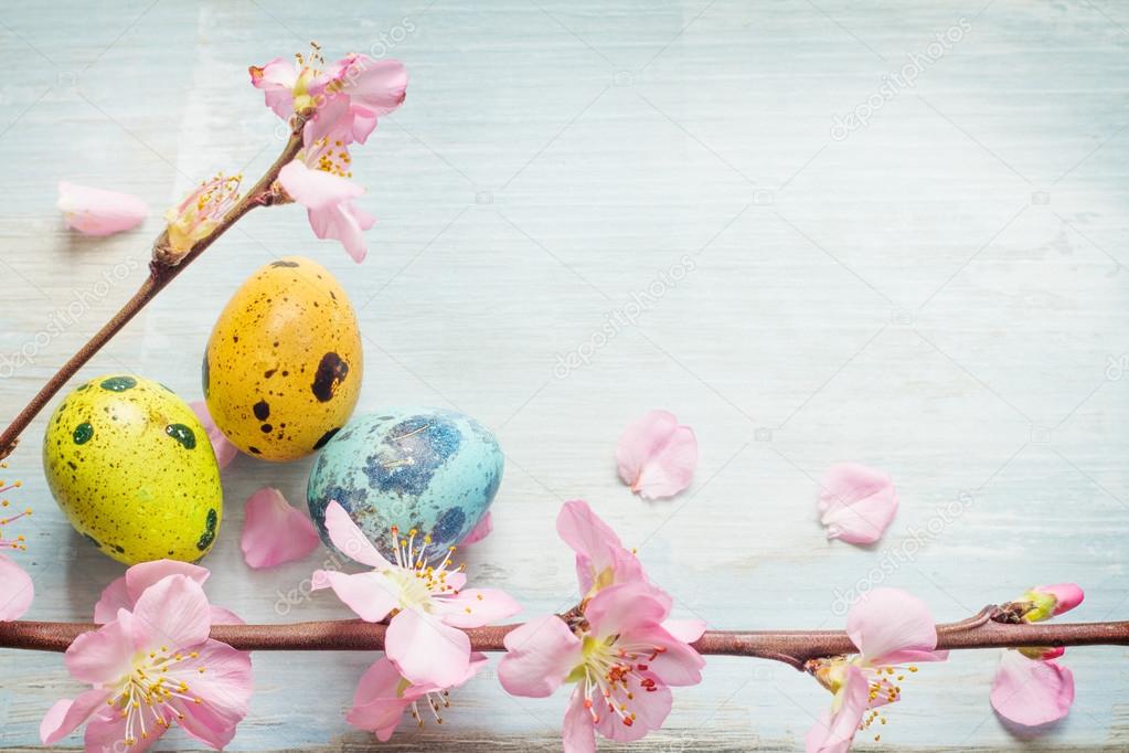 Easter eggs and cherry blossom retro blue background