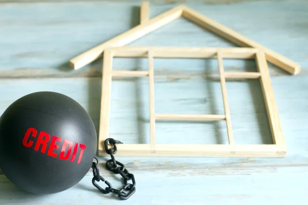 Slave housing loan concept with credit iron ball and house symbol — Stock Photo, Image