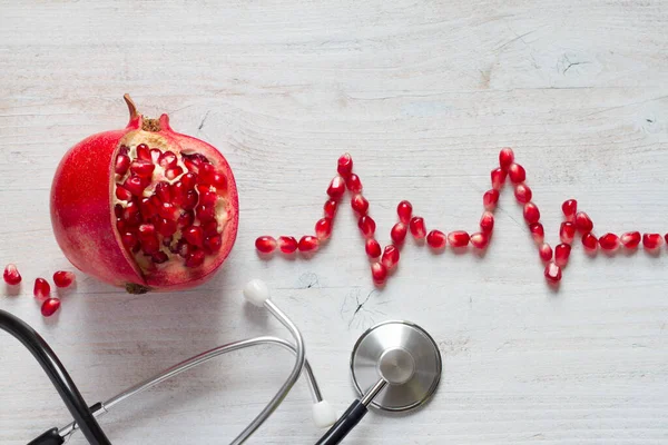 Fruit Pomegranate Stethoscope Ecg Cardiogram Pomegranate Seeds Healthy Heart Diet — Stock Photo, Image