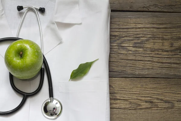 Alternative medicine stethoscope and green symbol background — Stock Photo, Image