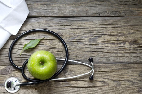 Alternative medicine stethoscope and green symbol background — Stock Photo, Image