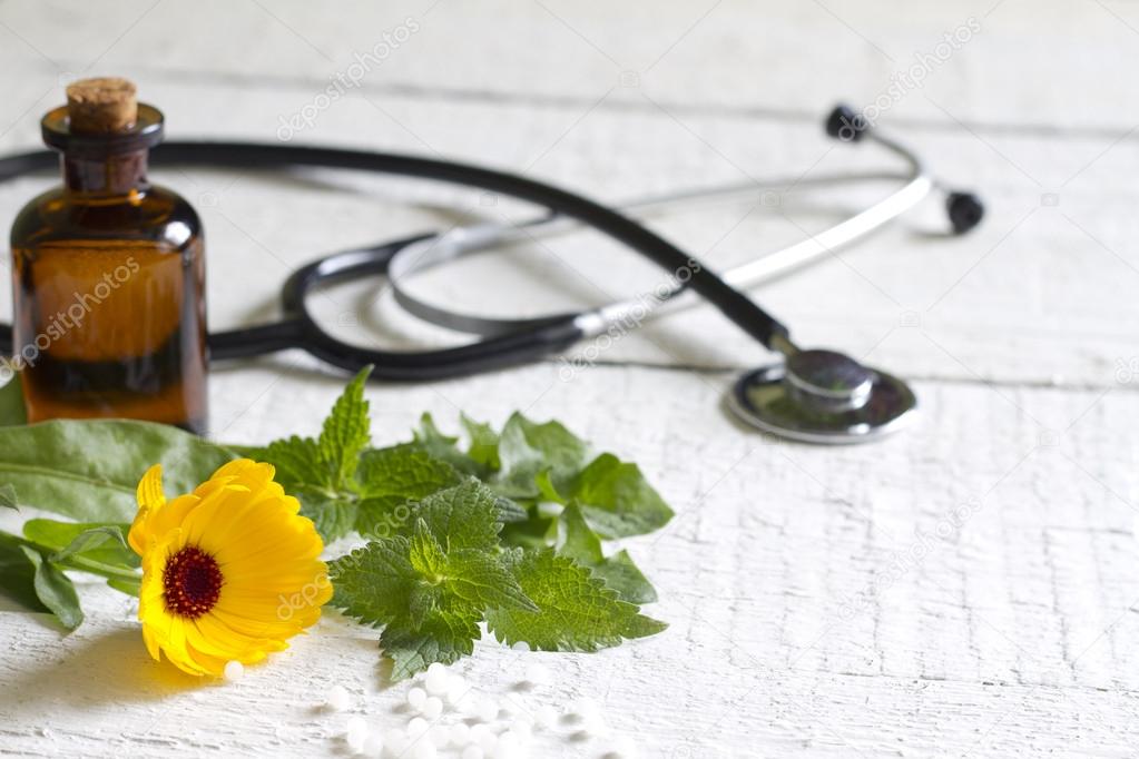 Alternative medicine herbs and stethoscope concept