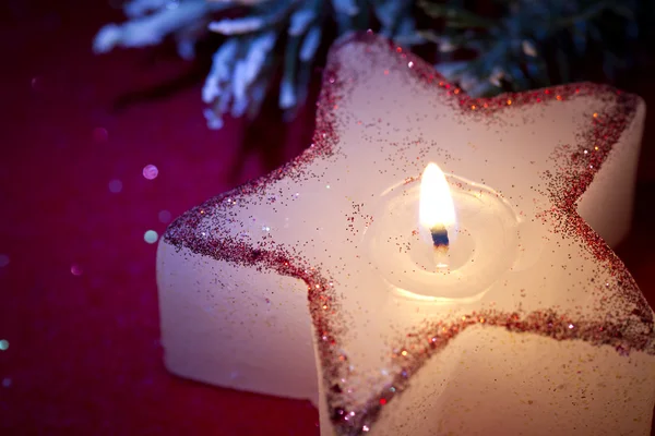 Christmas candle star in red closeup — Stock Photo, Image