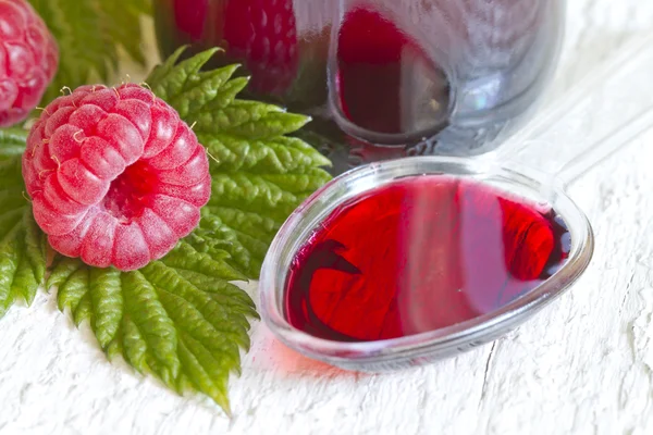 Raspberry syrup on spoon alternative medicine concept — Stock Photo, Image