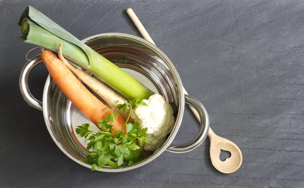 Raw vegetables pot and spoon love cooking concept — Stock Photo, Image