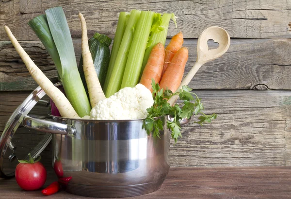 Fresh vegetables in the pot on vintage boards cooking concept — Stock Photo, Image