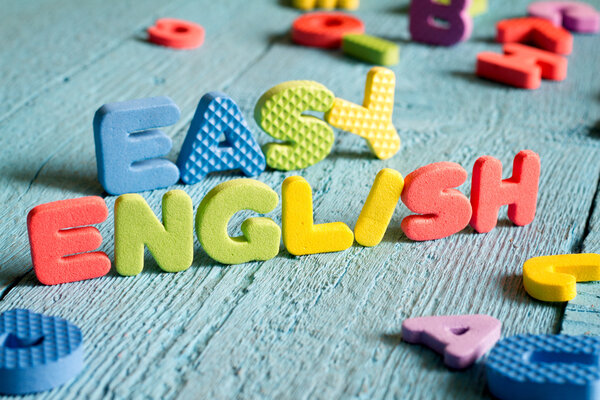 English is easy to learning concept with letters on blue boards