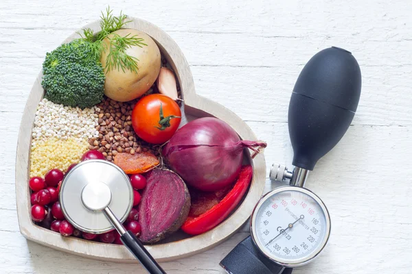 Healthy food in heart and lowering pressure sign concept — Stock Photo, Image