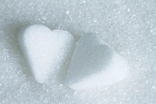 Tvar srdce na bílý cukr abstraktní záběr — Stock fotografie